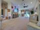 Spacious living room with comfortable seating, modern decor, and a ceiling fan at 4092 Troost St, North Port, FL 34288