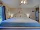 Bright bedroom with a king bed, soft lighting, and a door leading to another room in the house at 4092 Troost St, North Port, FL 34288