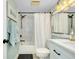 Updated bathroom with shower and tub combo with marble tile at 410 Cerromar S Cir # 240, Venice, FL 34293