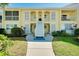 Charming two-story condo building with a well-maintained lawn and inviting stairway at 410 Cerromar S Cir # 240, Venice, FL 34293