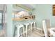 Eat-in kitchen area with breakfast bar and stools looking into the kitchen at 410 Cerromar S Cir # 240, Venice, FL 34293