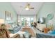 Bright living room features sliding doors to the balcony and comfortable seating arrangements at 410 Cerromar S Cir # 240, Venice, FL 34293