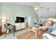 Spacious living room with vaulted ceilings, comfortable seating, and access to the other rooms at 410 Cerromar S Cir # 240, Venice, FL 34293