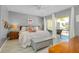 Comfortable main bedroom with balcony access, inviting space to unwind and relax at 410 Cerromar S Cir # 240, Venice, FL 34293