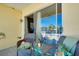 Cozy patio with wicker furniture, cushions and a pleasant outdoor view at 410 Cerromar S Cir # 240, Venice, FL 34293