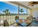Spacious patio with a table and chairs overlooking lush golf course views at 410 Cerromar S Cir # 240, Venice, FL 34293
