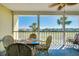 Serene patio with a glass table, palm trees and golf course views at 410 Cerromar S Cir # 240, Venice, FL 34293