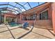 Backyard featuring an enclosed pool and lounge chairs, perfect for relaxing and entertaining at 4409 Crews Ct, Port Charlotte, FL 33952