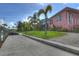 Exterior of waterfront property, showcasing lush landscaping, a private dock, and a spacious green lawn at 4409 Crews Ct, Port Charlotte, FL 33952