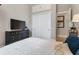 Bedroom featuring a king bed, dresser with TV, and closet with doors for storage at 4409 Crews Ct, Port Charlotte, FL 33952