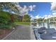 Waterfront property featuring a private dock, seawall, lush landscaping, and direct access to the canal at 4409 Crews Ct, Port Charlotte, FL 33952