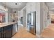 Spacious kitchen with an island, stainless steel appliances, and open access to other rooms at 4409 Crews Ct, Port Charlotte, FL 33952