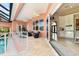 Covered lanai offers seamless indoor/outdoor living with a beautiful pool view and access to the kitchen at 4409 Crews Ct, Port Charlotte, FL 33952