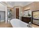 A stand alone tub, dual sinks, and a private toilet are all a part of this spacious main bathroom at 4409 Crews Ct, Port Charlotte, FL 33952