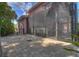 Screened in lanai showcasing an outdoor kitchen, patio and access to the property's backyard at 4409 Crews Ct, Port Charlotte, FL 33952