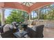 Outdoor kitchen and entertaining area with grill, bar seating, and cozy lounge space with lots of seating at 4409 Crews Ct, Port Charlotte, FL 33952