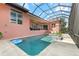 Inviting screened-in pool area with a relaxing atmosphere and space for entertaining in the beautiful backyard at 4409 Crews Ct, Port Charlotte, FL 33952
