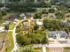 Bird's-eye view of a single story home and backyard pool surrounded by lush greenery, outlined in red at 4443 Abcor Rd, North Port, FL 34286