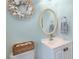 Stylish half-bathroom with modern fixtures, neutral color palette, and coastal-themed decorations at 4443 Abcor Rd, North Port, FL 34286