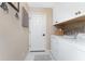 Clean and organized laundry room with modern appliances and ample storage space at 4443 Abcor Rd, North Port, FL 34286