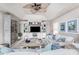 Cozy living room featuring a large entertainment center, comfortable sofa, and stylish decor at 4443 Abcor Rd, North Port, FL 34286