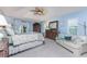 Spacious main bedroom with a tray ceiling, ceiling fan, and an oversized dresser and mirror at 4443 Abcor Rd, North Port, FL 34286