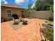 Paver patio featuring a seating area with fire pit, and views of the landscaped backyard at 4443 Abcor Rd, North Port, FL 34286