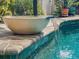 Close-up of the pool's decorative waterfall feature, adding a touch of elegance to the outdoor space at 4443 Abcor Rd, North Port, FL 34286