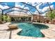 Stunning screened-in pool and patio area, ideal for relaxation and outdoor gatherings at 4443 Abcor Rd, North Port, FL 34286