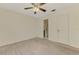 Bedroom featuring neutral carpet and an open doorway to the bathroom at 5641 Mashie Cir, North Port, FL 34287