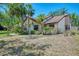 Charming single-story home with well-manicured landscaping and a welcoming facade at 5641 Mashie Cir, North Port, FL 34287