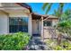 Inviting front entrance with lush landscaping, walkway, and a charming facade at 5641 Mashie Cir, North Port, FL 34287