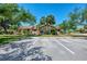 Well-maintained property with mature trees and manicured landscaping at 5641 Mashie Cir, North Port, FL 34287
