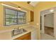 Bright kitchen featuring a stainless steel sink, and large window with natural light at 5641 Mashie Cir, North Port, FL 34287
