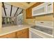 Cozy kitchen featuring wooden cabinets, bright countertops, and modern appliances at 5641 Mashie Cir, North Port, FL 34287