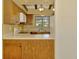 Well-lit kitchen featuring wooden cabinets, modern appliances, and a functional layout at 5641 Mashie Cir, North Port, FL 34287