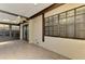 Tiled lanai featuring a ceiling fan and sliding glass door access to the interior at 5641 Mashie Cir, North Port, FL 34287