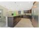Open concept kitchen with granite countertops and stainless steel appliances at 6274 Skyview Dr, North Port, FL 34291