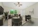 Cozy living room with vaulted ceiling, stylish decor and a large window view at 6274 Skyview Dr, North Port, FL 34291