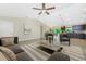 Bright and airy living space featuring modern furniture, neutral tones, and access to the dining and kitchen areas at 6274 Skyview Dr, North Port, FL 34291