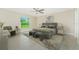 Comfortable main bedroom featuring a ceiling fan, tile flooring, neutral paint, and an open window at 6274 Skyview Dr, North Port, FL 34291