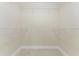 Empty walk-in closet with wire shelving and tile floor at 6274 Skyview Dr, North Port, FL 34291