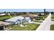 Aerial view of attractive home featuring lush landscaping and a well-manicured lawn at 7148 N Blue Sage, Punta Gorda, FL 33955