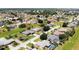Aerial view of a suburban neighborhood, lush landscaping, and well-maintained lawns at 7148 N Blue Sage, Punta Gorda, FL 33955