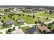Aerial view of suburban homes with mature trees, manicured lawns and a community feel at 7148 N Blue Sage, Punta Gorda, FL 33955