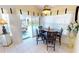 Breakfast nook features a chandelier, breakfast table, seating for four, and a view of the pool at 7148 N Blue Sage, Punta Gorda, FL 33955