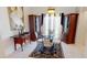 Dining room features elegant glass table, seating for four, and classic decor at 7148 N Blue Sage, Punta Gorda, FL 33955