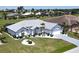 Beautiful single-Gathering home featuring a well-maintained lawn, manicured landscaping and a long driveway at 7148 N Blue Sage, Punta Gorda, FL 33955