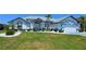 Charming home featuring well-maintained landscaping and an inviting front entrance at 7148 N Blue Sage, Punta Gorda, FL 33955