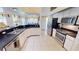 Bright kitchen features stainless steel appliances, white cabinetry, and a spacious counter at 7148 N Blue Sage, Punta Gorda, FL 33955